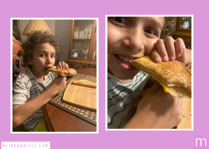 Anthony eating a delicious dairy-free cheese sandwich for lunch.