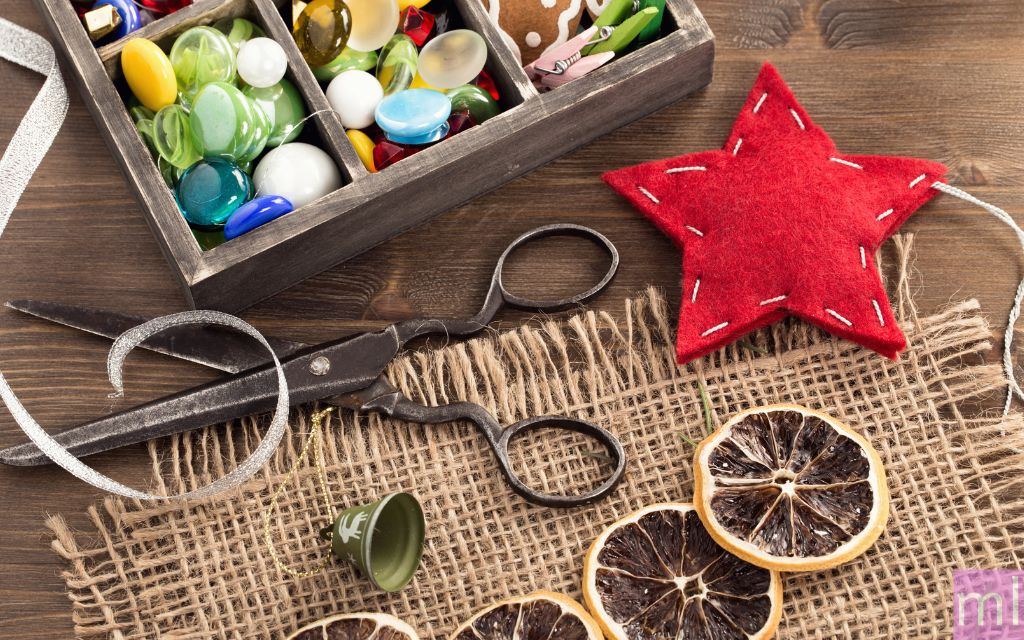Scissors with crafting, marbles and dried oranges and a giant red star, easy spring crafts