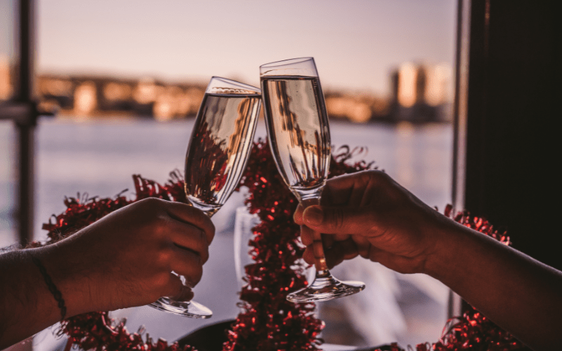 wine galsses two hands toasting