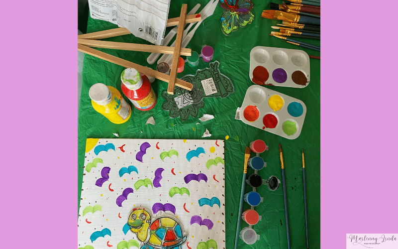 painting set with images of green, blue, and purple birds