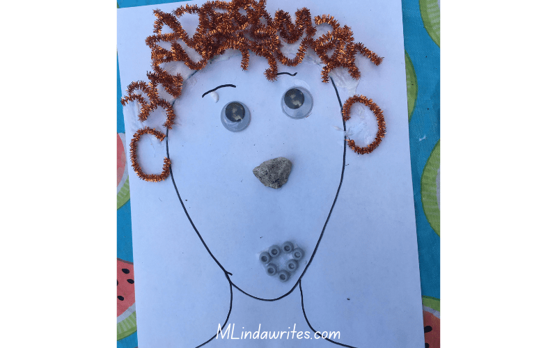 a self portrait drawing with household items a curly haired boy