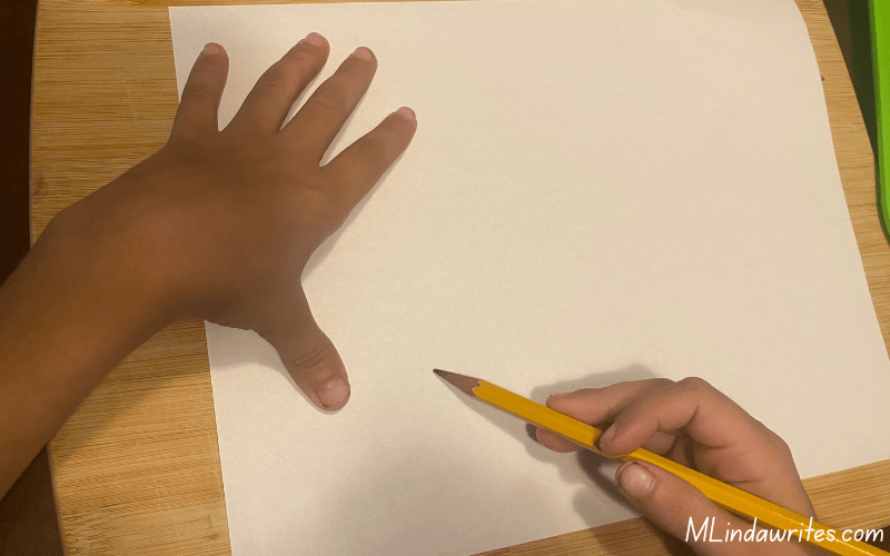 image of my sons hands holding a pencil ready to draw