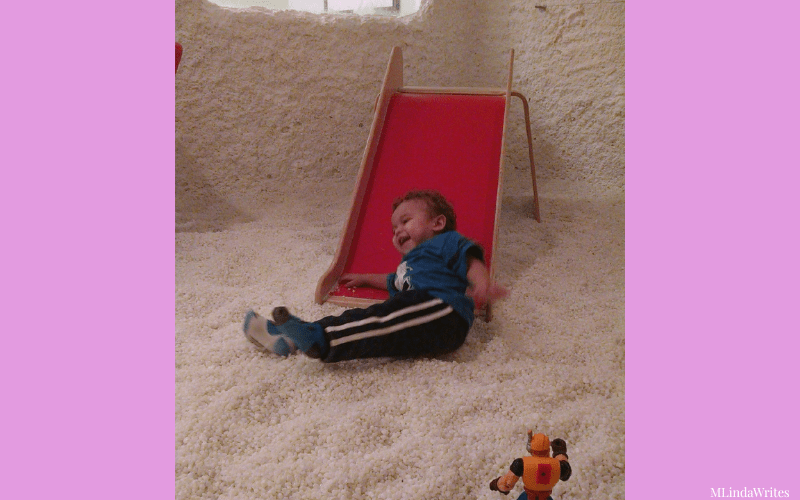 allergy relief toddler sliding down the slide