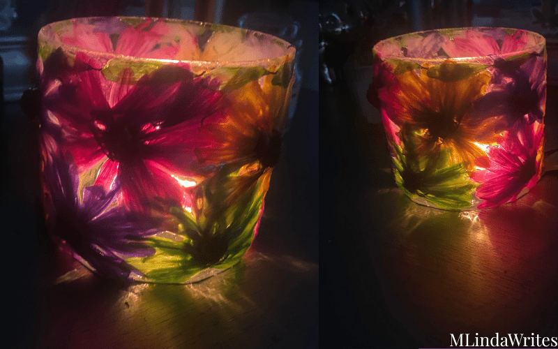 decorated candle with real flowers glowing