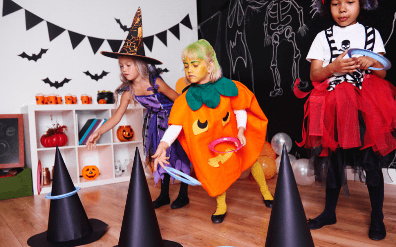 Halloween party ideas kids tossing rings on witches hat