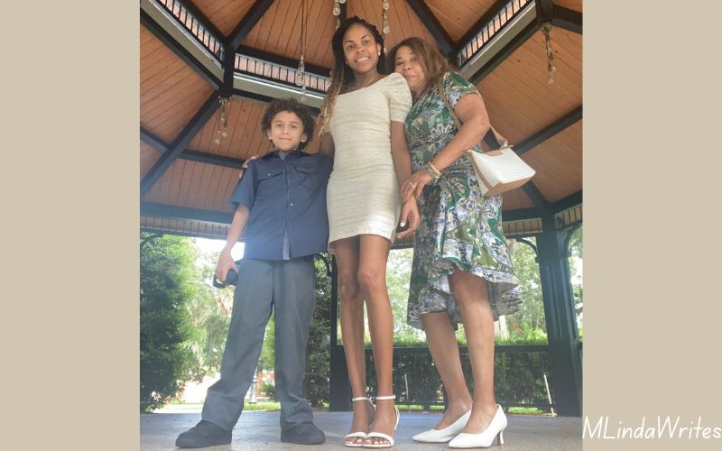 Marlenny Linda writes and her family, her son Anthony and her mother Margarita all posed smiling.